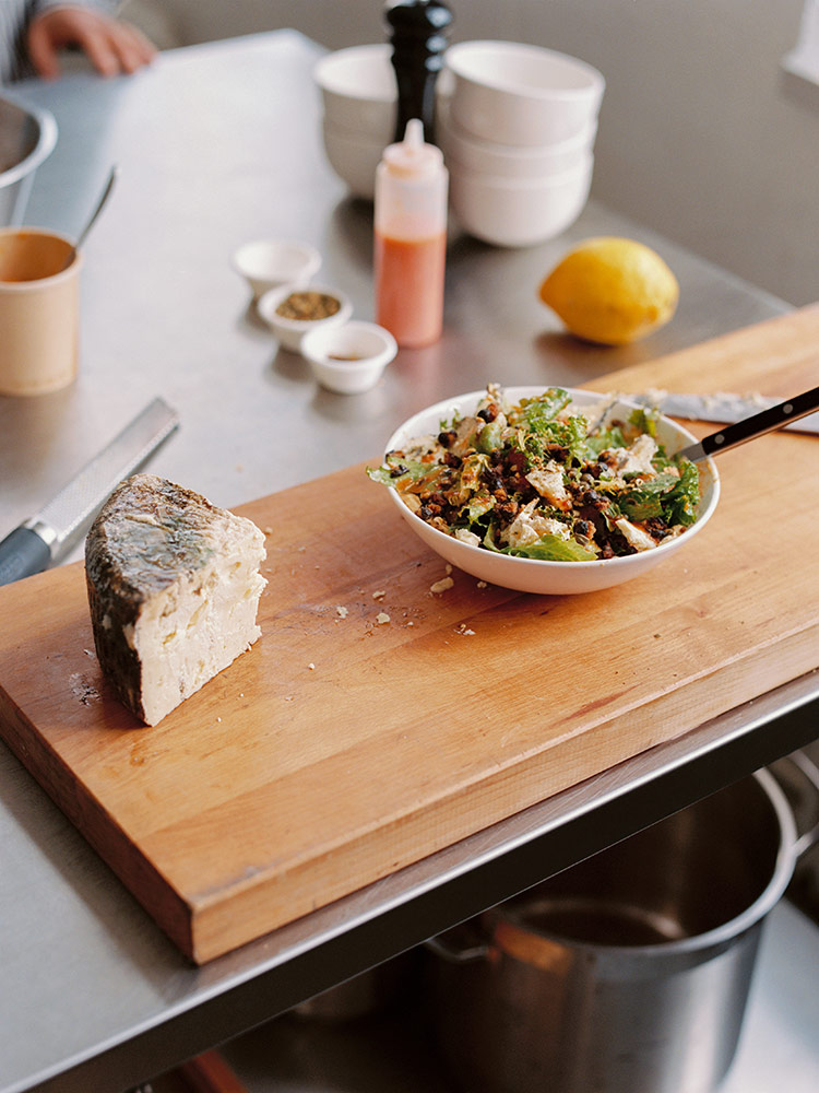 A cheese wedge and a salad